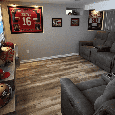Football themed entertainment space adorned with team memorabilia and comfortable seating a testament to creating personalized recreation spaces for New Jersey sports enthusiasts