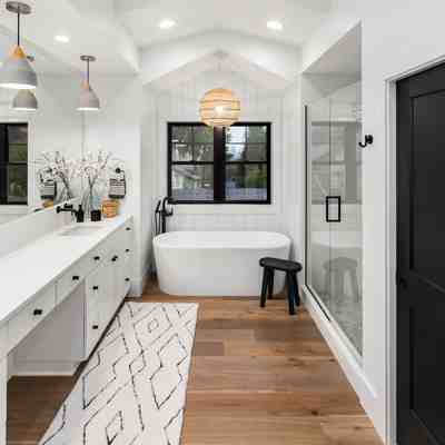 Luxurious bathroom makeover in nj boasting marble floors and a freestanding tub
